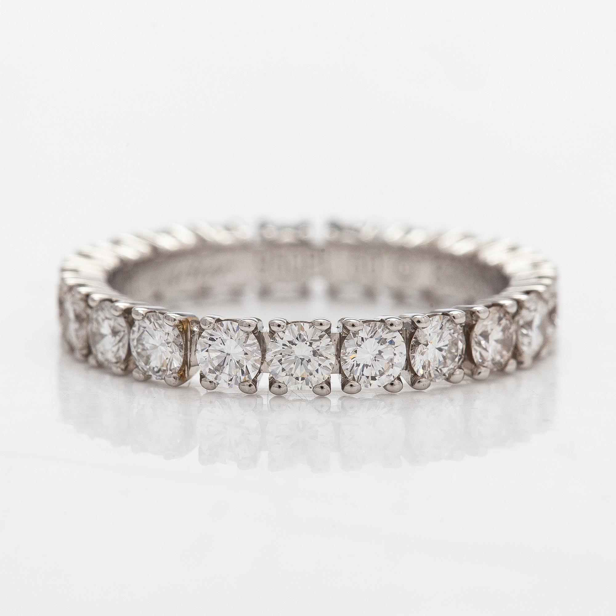 Cartier, a platinum and brilliant-cut diamond eternity ring.