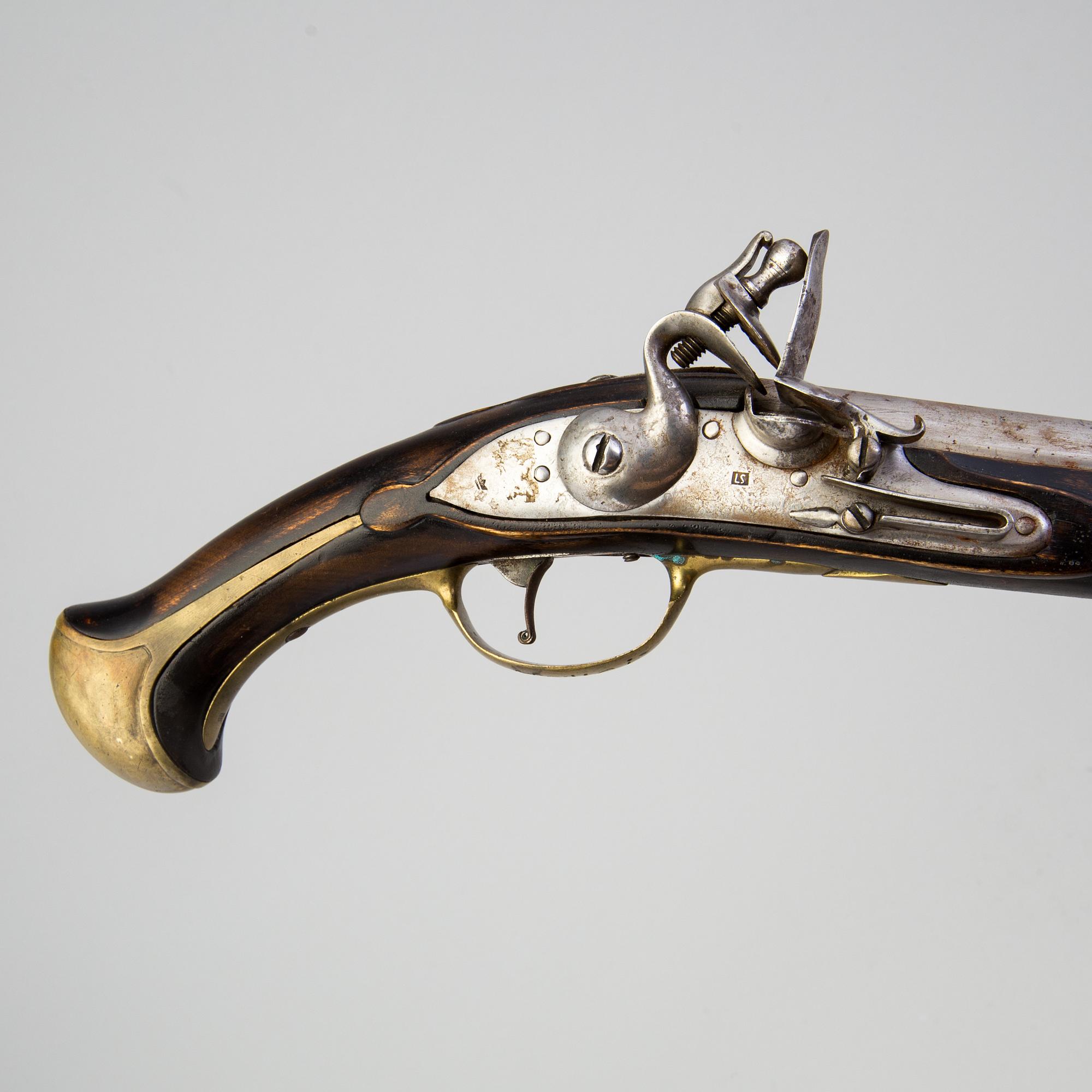 A 18th century flintlock pistol.