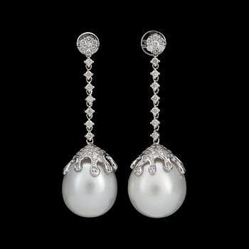 135. A pair of cultured South Sea pearl and diamond earrings. Diamonds total carat weight circa 1.33 cts.