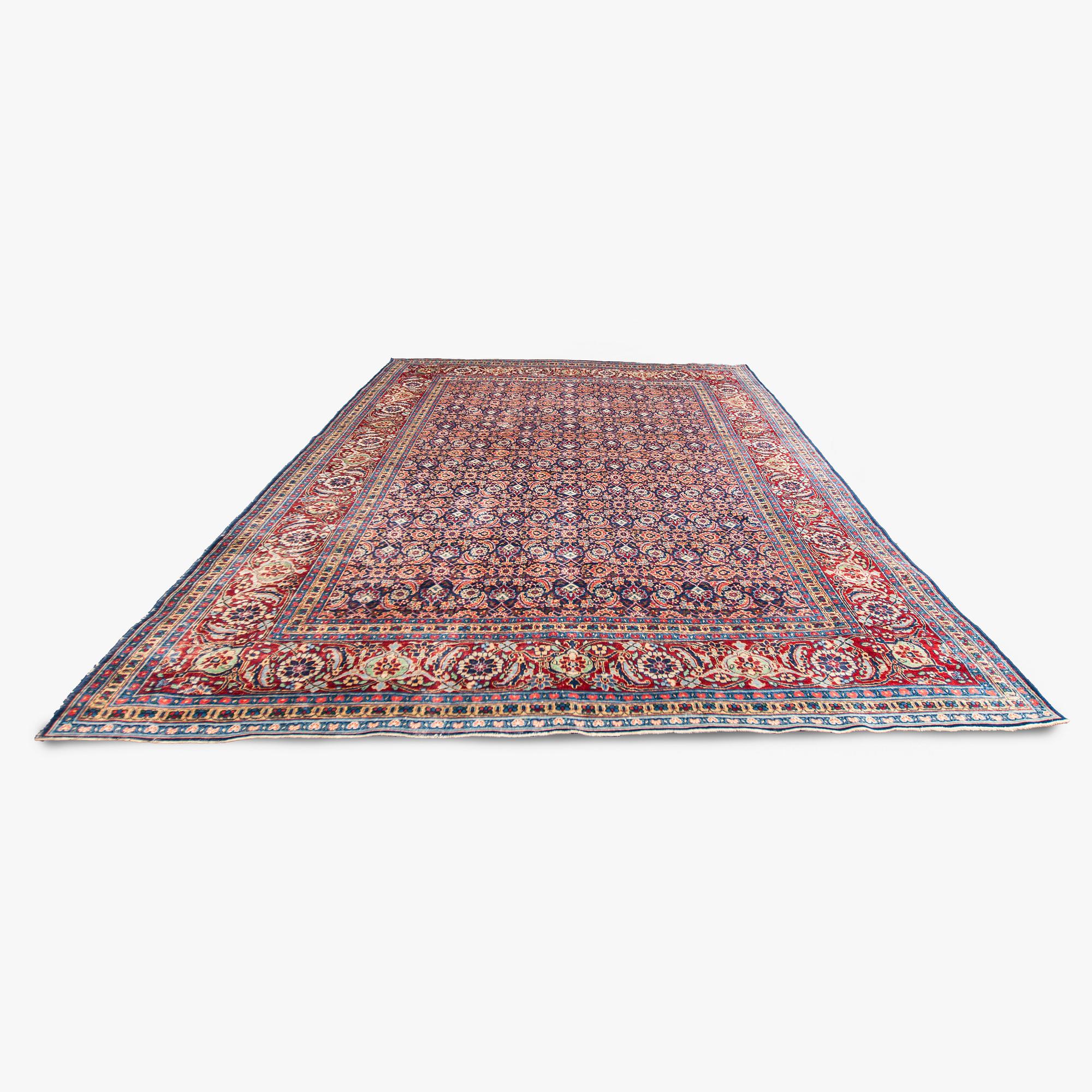 A carpet, a semi-antique Tabriz, ca 357 x 255 cm.