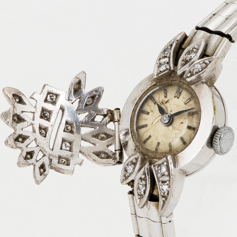 A ladies diamond watch.