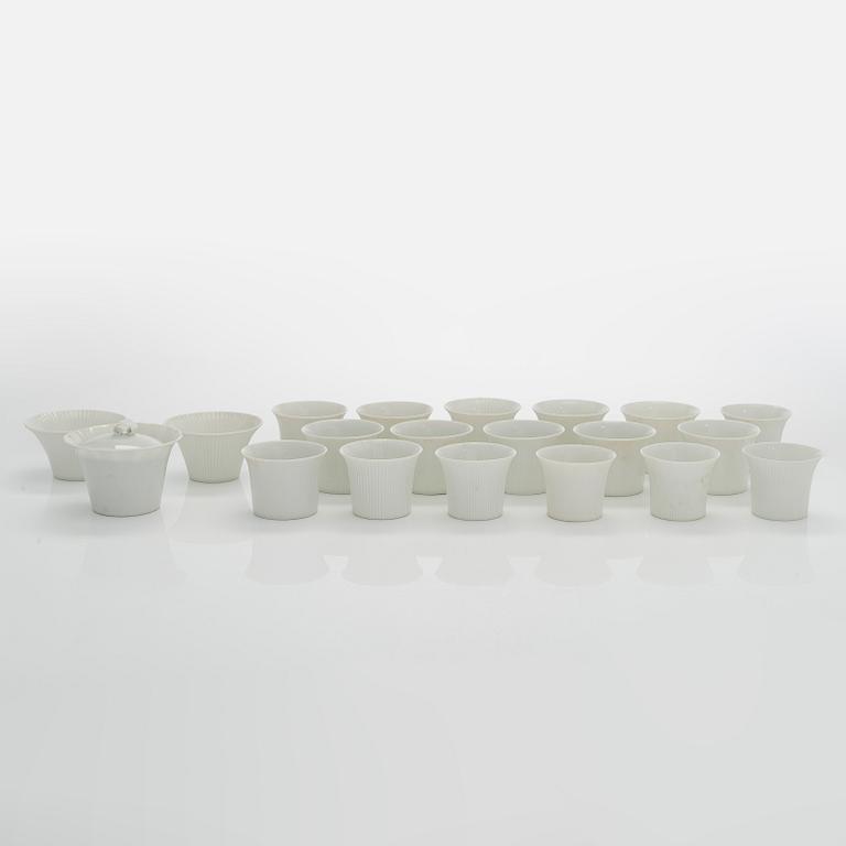 Aune Siimes, a set of twenty 1960's porcelain cream cups and twenty nine saucers for Arabia.