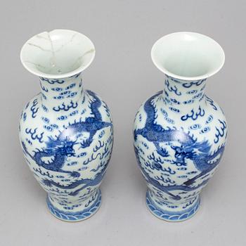 A pair of Chinese blue and white dragon vases, early 20th century, with a Qianlong mark.