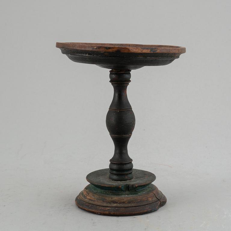 A 19th century wooden butter stand.