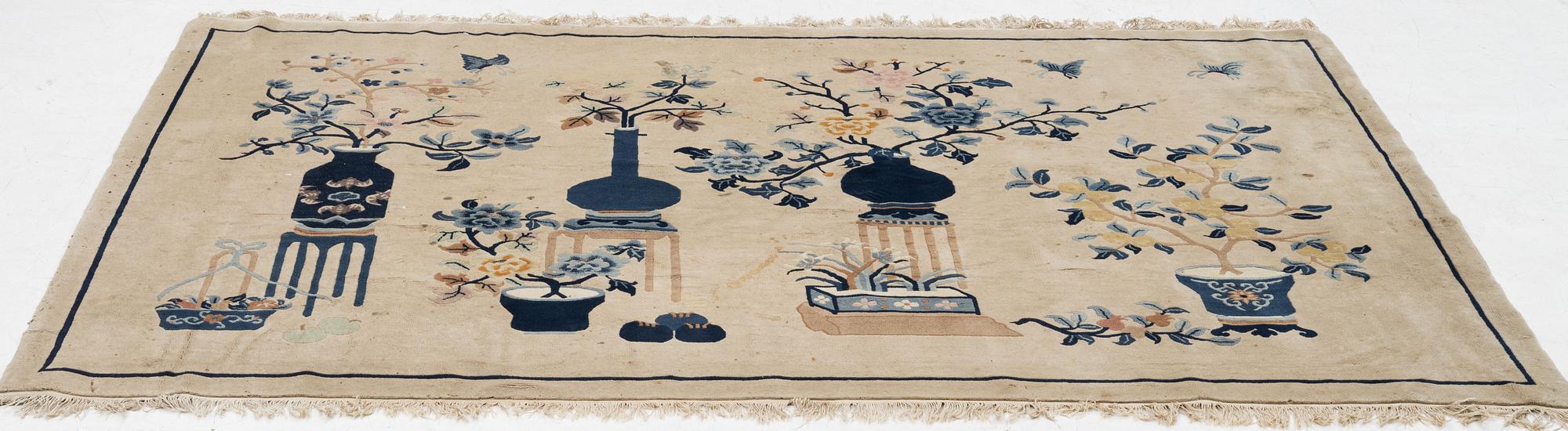 A semi-antique pictoral Chinese rug, approx. 240 x 170 cm.