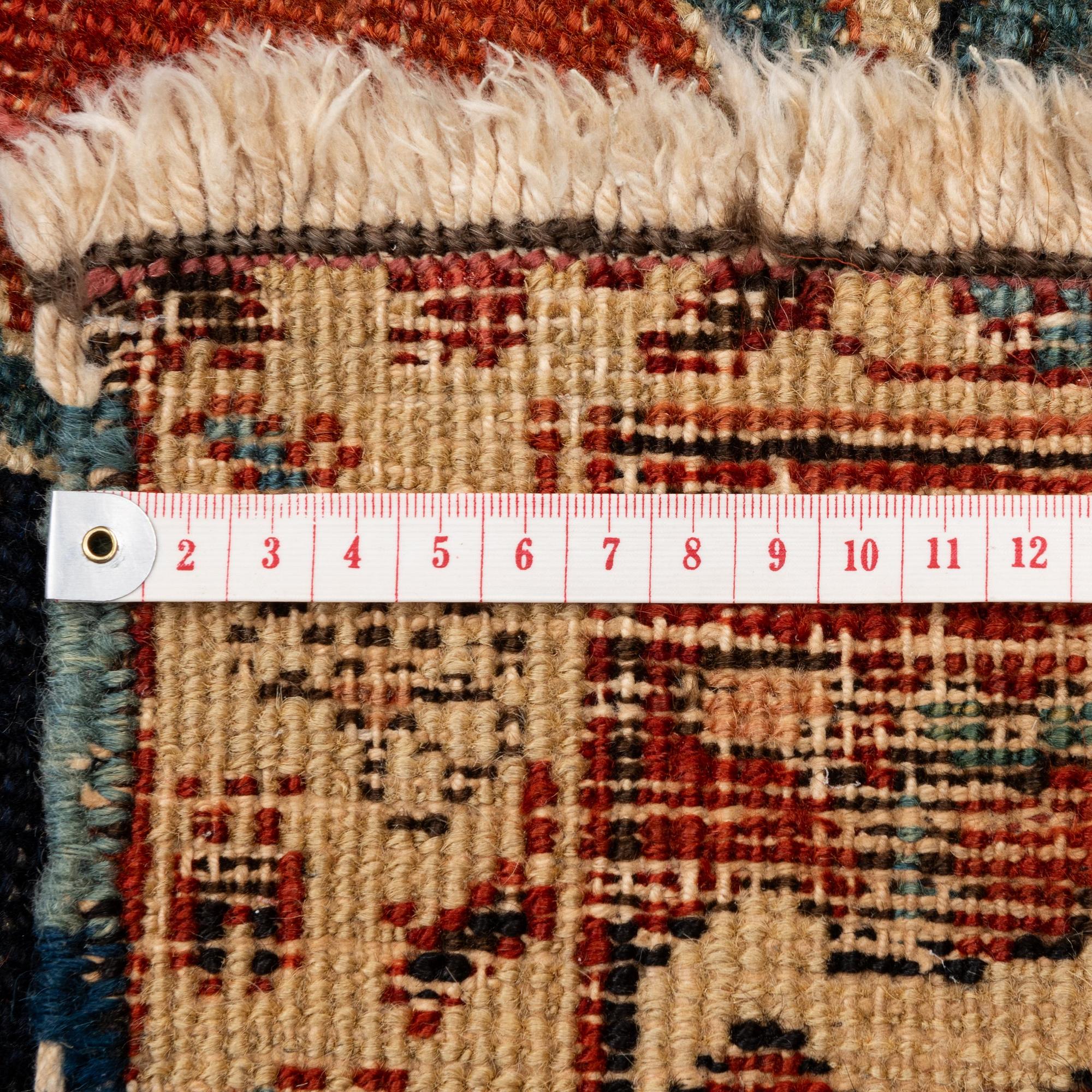 An antique Heriz carpet, Northwest Persia (Iran), c. 397 x 300 cm.