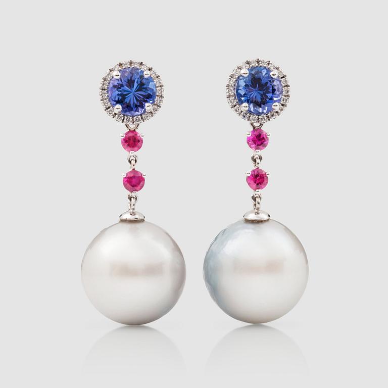 A pair of cultured South Sea, ruby, tanzanite and brilliant-cut diamond earrings.