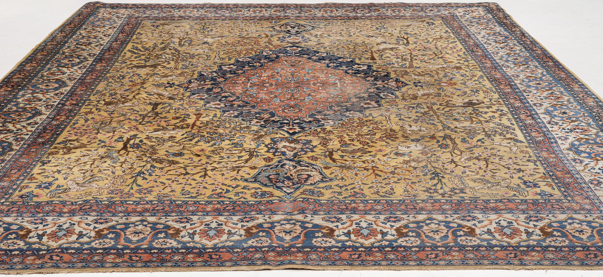 An Antique Tabriz carpet, Northwest Persia (Iran), signed Alabaf c 387 x 299 cm.