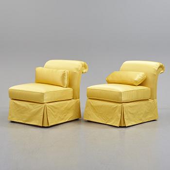 A pair of armchairs upholstered with Veraseta silk satin.