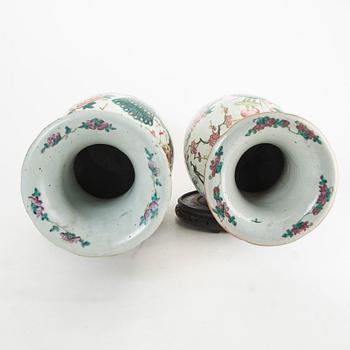A pair of famille rose vases, late Qing dynasty, circa 1900.