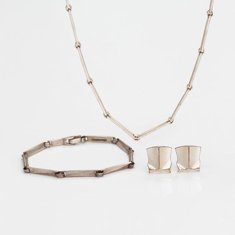 Lapponia, A necklace, bracelet and a pair of earrings made of sterling silver.