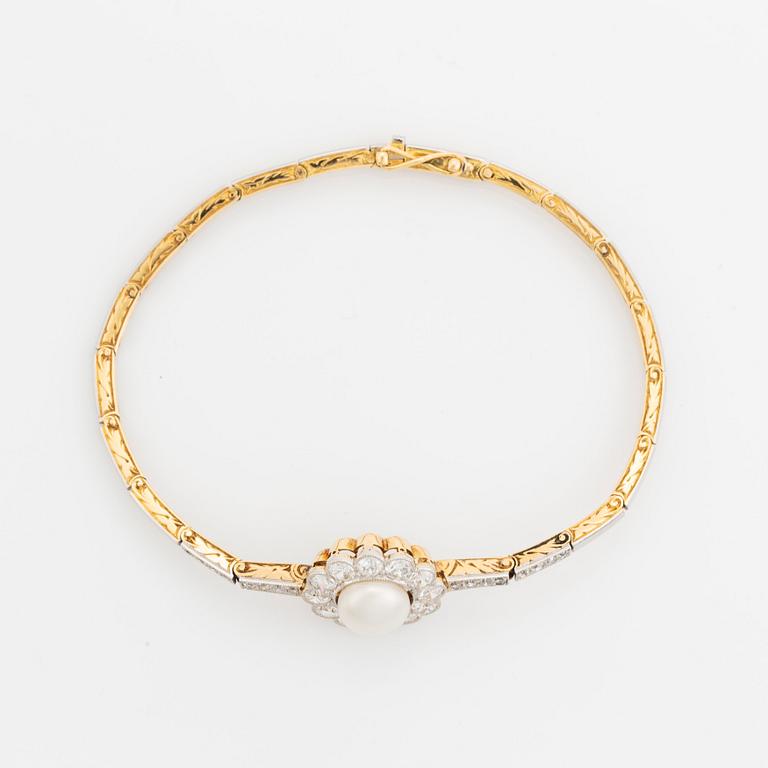 A gold and platinum bracelet with a bouton pearl and set with old- and eight-cut diamonds.