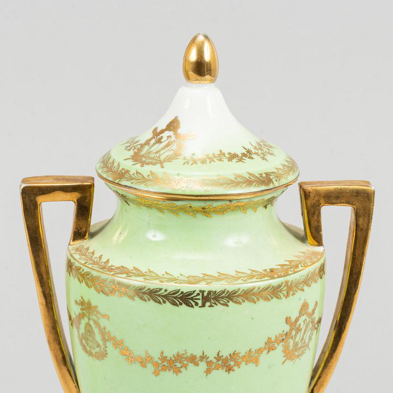 A pair of porcelain urns, possibly naples, first half of the 20th century.