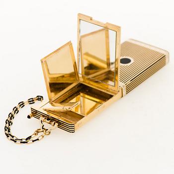 A Cartier Art Deco Vanity Case/Minaudière in 18K gold, black enamel and onyx.