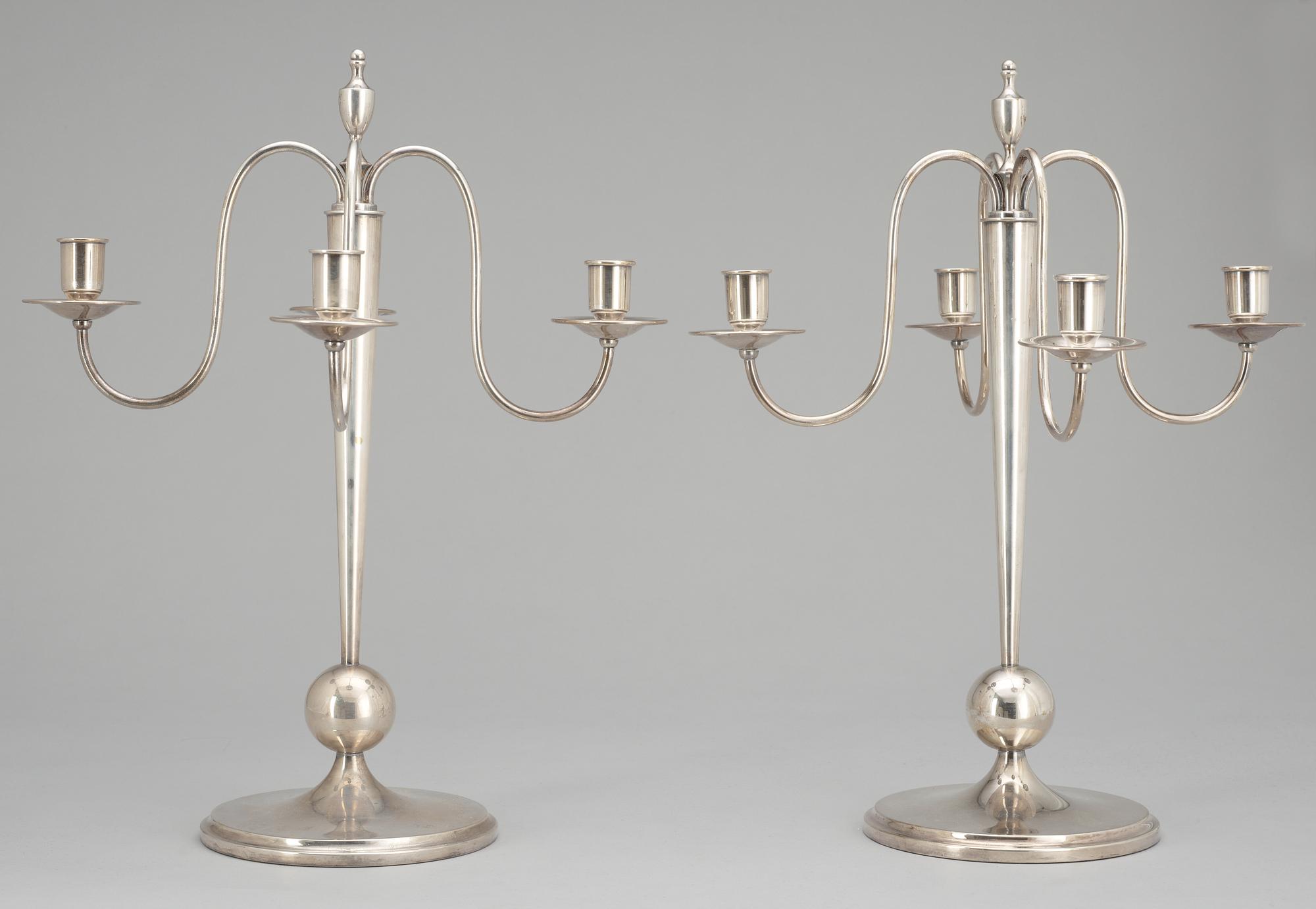 A pair of CG Hallberg silverplated candelabra.