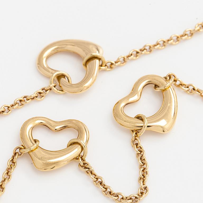 Tiffany & Co, Elsa Peretti, an 18K gold 'Open Heart' bracelet.