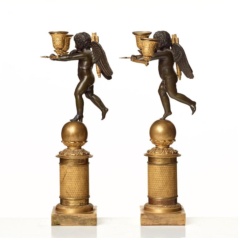 A pair of French Empire two-light candelabra.