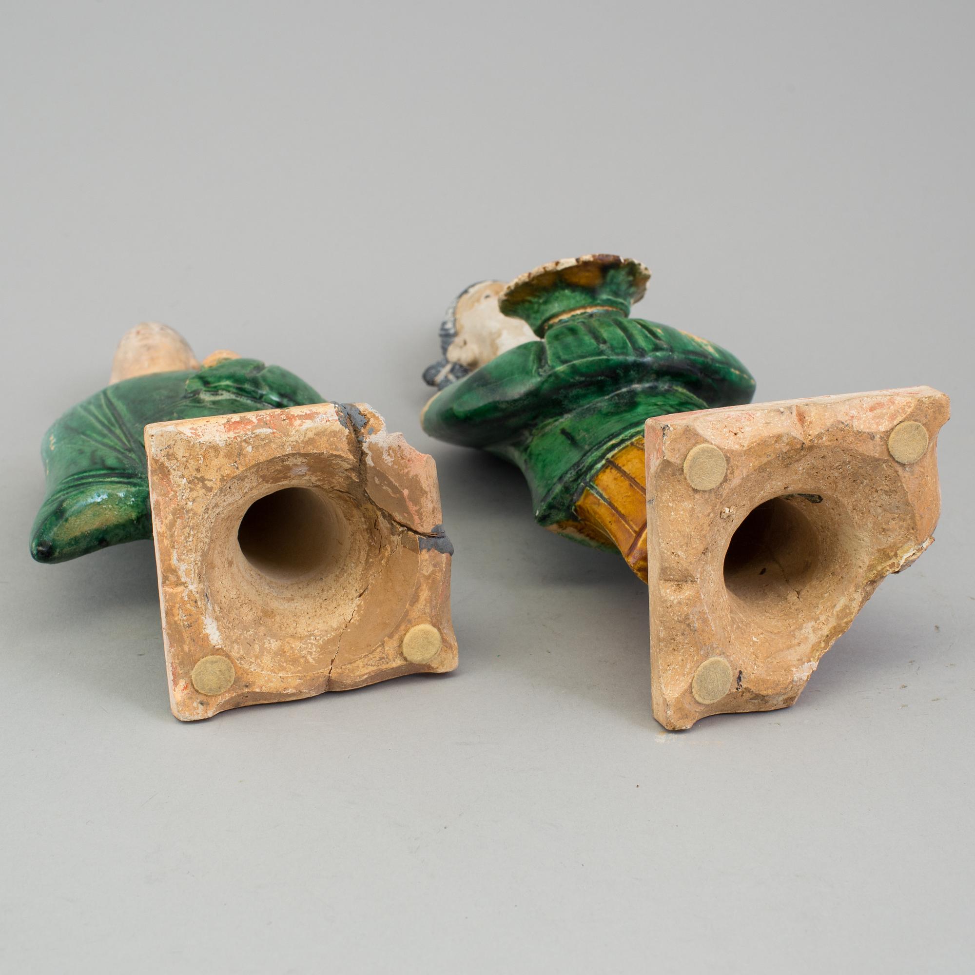 A group of eight chinese figures with three objects, earthenware, Ming dynasty.