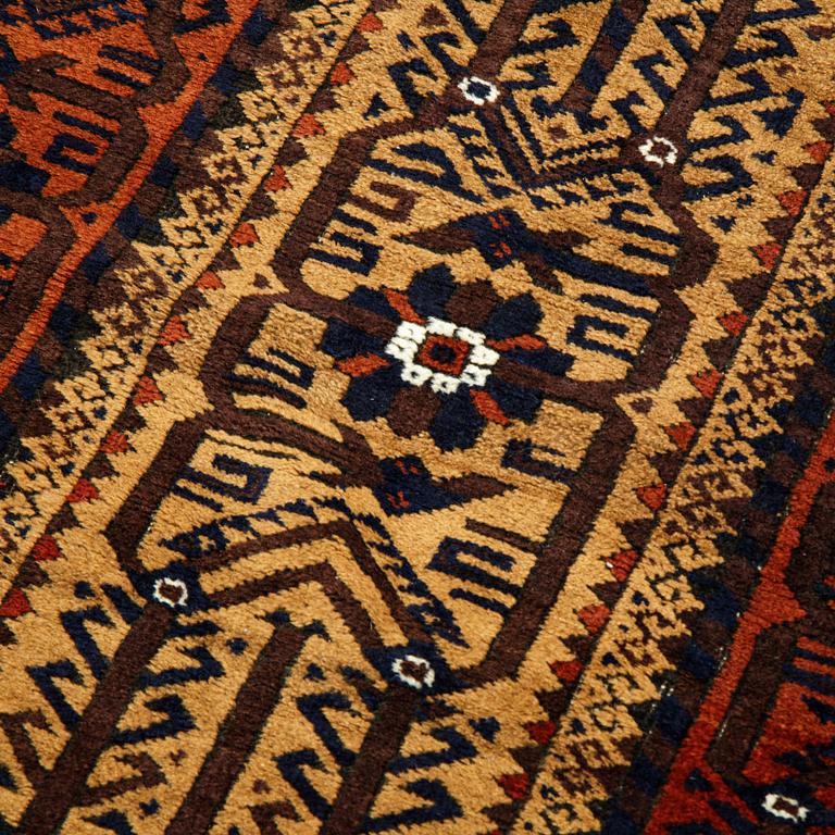 A rug, a semi-antique Baluch, ca 166 x 92 cm.
