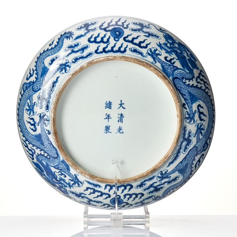A large blue and white 'five clawed dragon' dish, Qing dynasty, Guangxu mark and period (1875-1908).