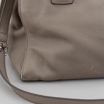 Prada, a leather handbag.