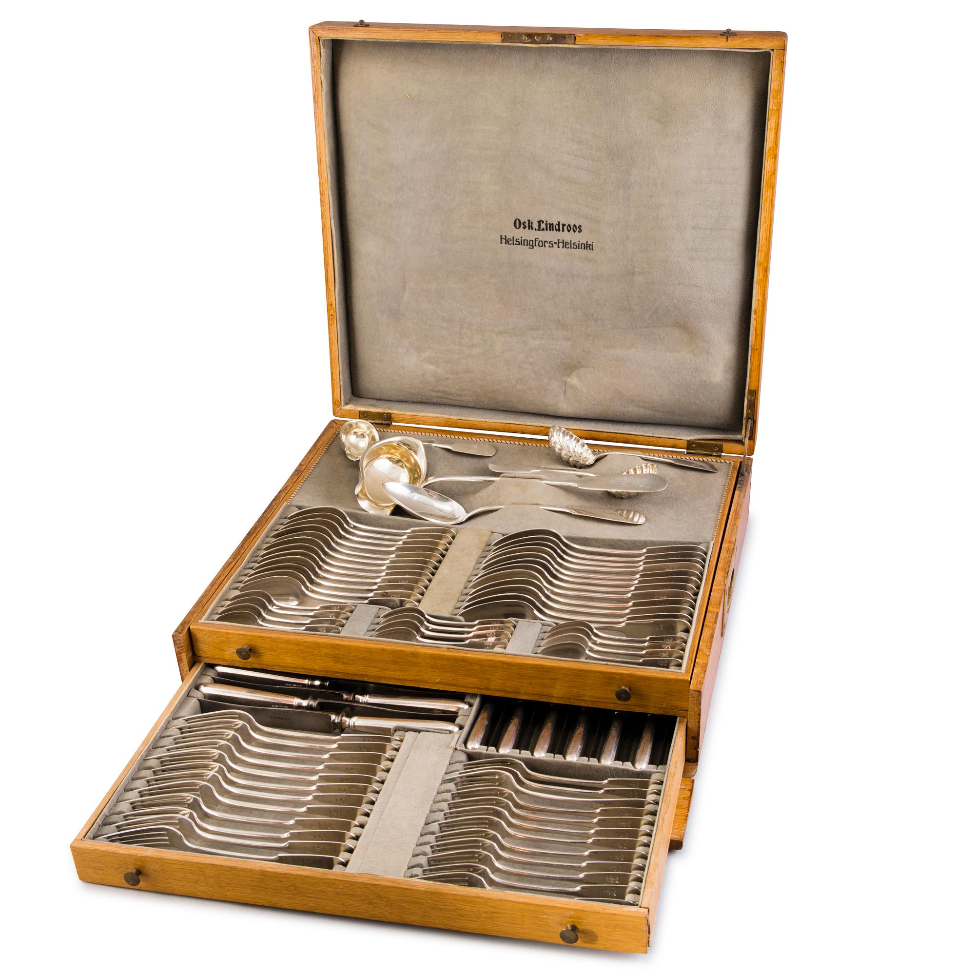 A 89-piece set of 'Helsinki' silver cutlery in wooden case, mark of Oskar Lindroos, Helsinki 1917-1925.