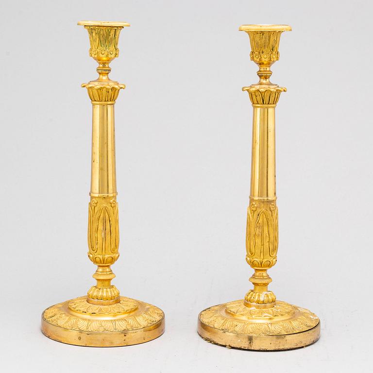 A pair of French Empire candlesticks, early 19th century.