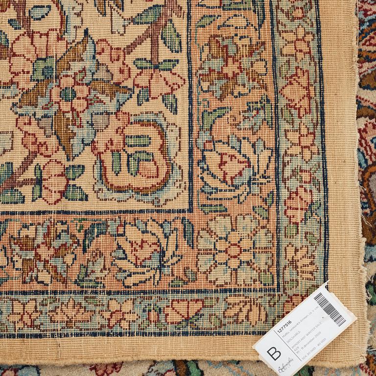 A carpet, a semi-antique Kerman, ca 510,5-513 x 315-318,5 cm.