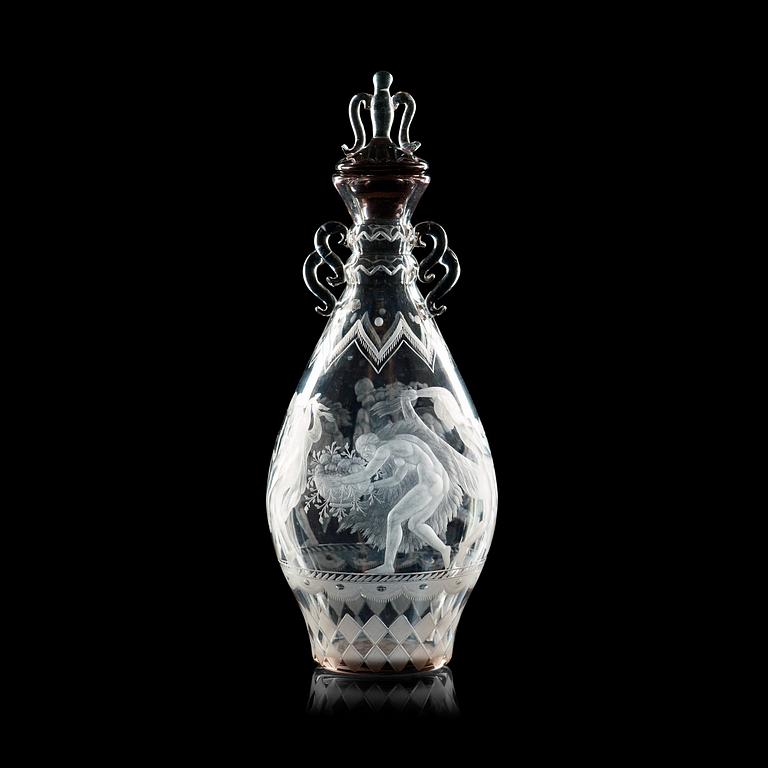 A Simon Gate engraved glass decanter with stopper, Orrefors 1925.