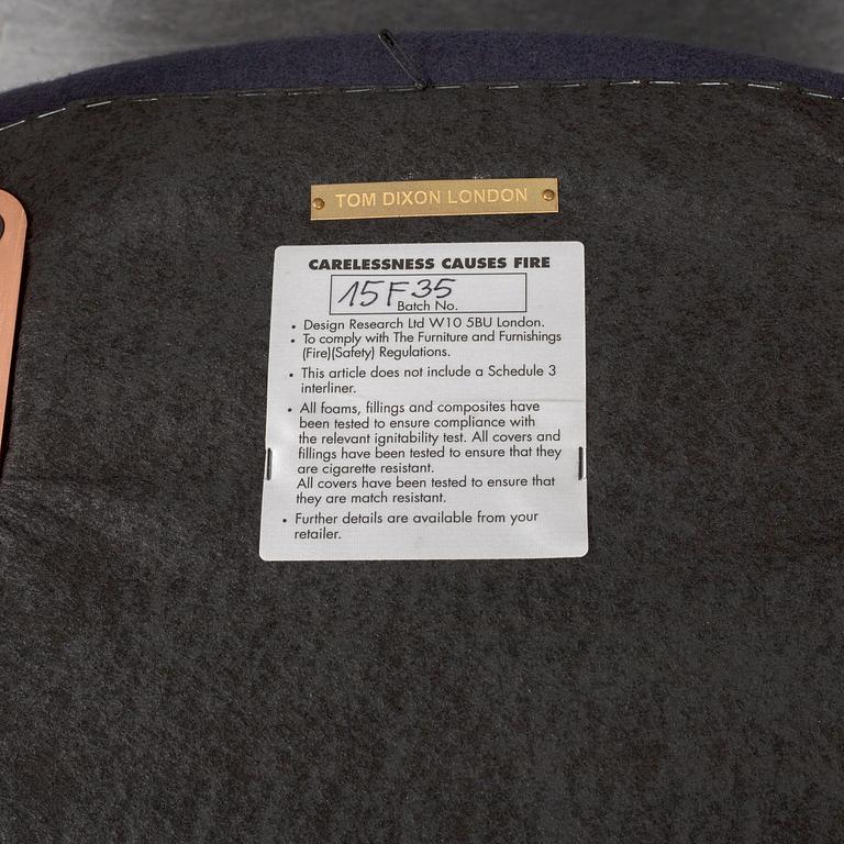 A Tom Dixon "Wingback Dining Chair" from Tom Dixon.