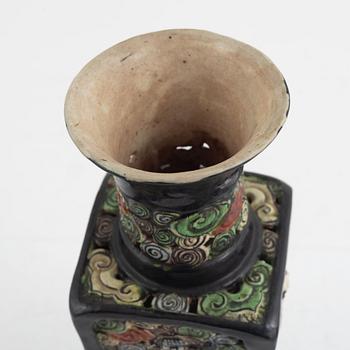 A Chinese famille noire pierced vase, Qing dynasty, 19th century.