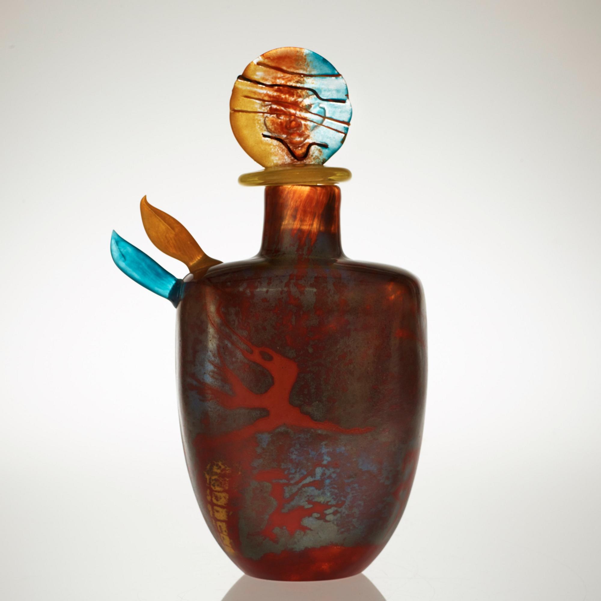 A Kjell Engman cast glass bottle with stopper, Kosta Boda 1991.