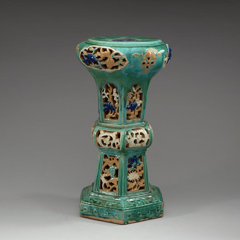 A green glazed Shiwan-ware stool, Qing dynasty, 19th Century.