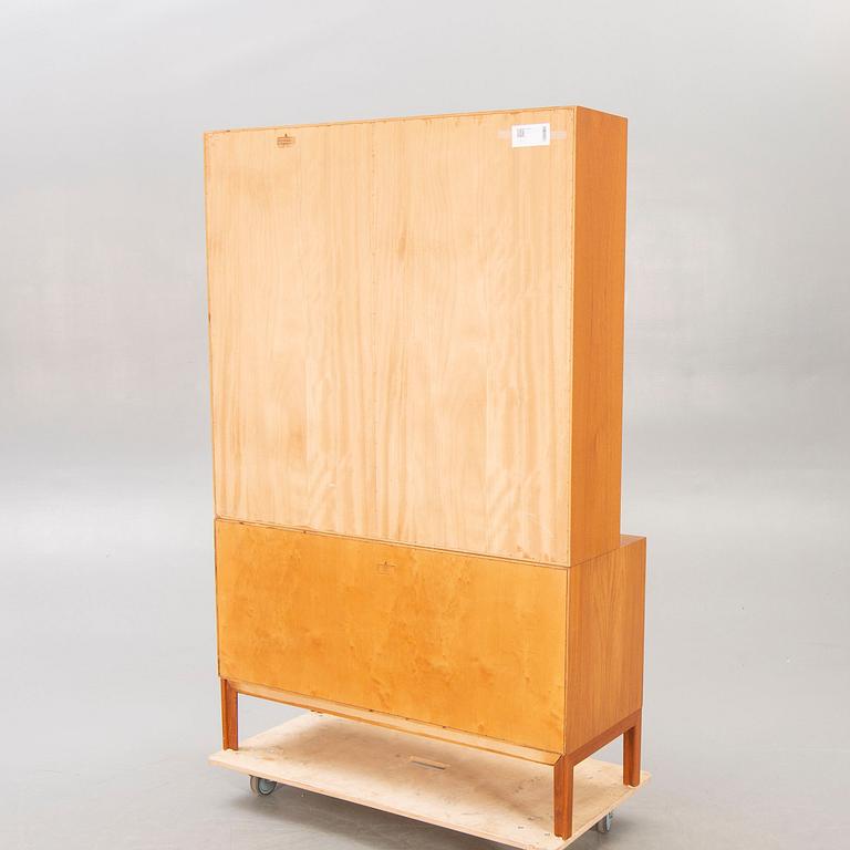 An Alf Svensson teak and rattan 1960/70s bookshelf.