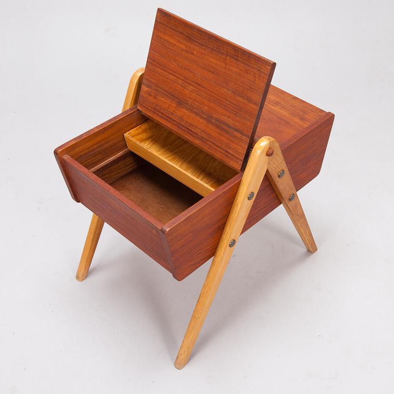 A 1950's sewing table in teak.