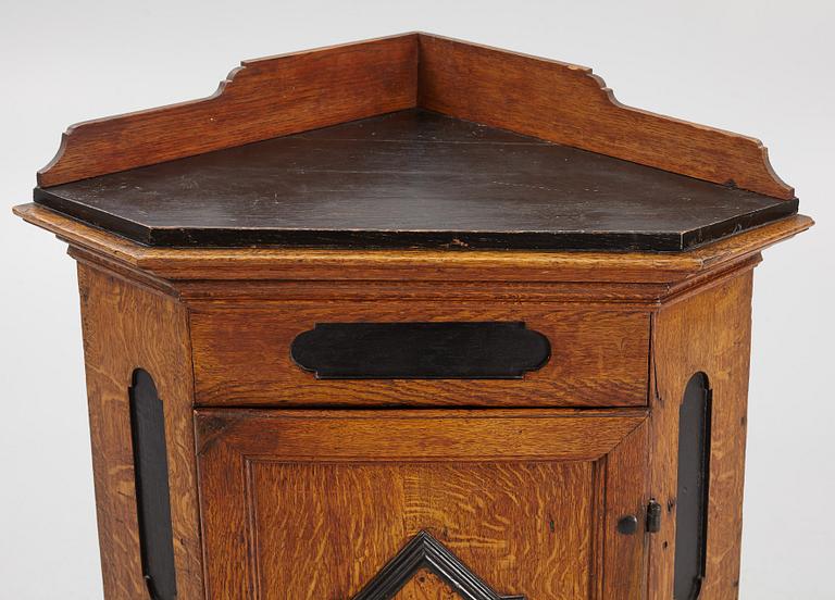 A Baroque corner cabinet, 18th Century.