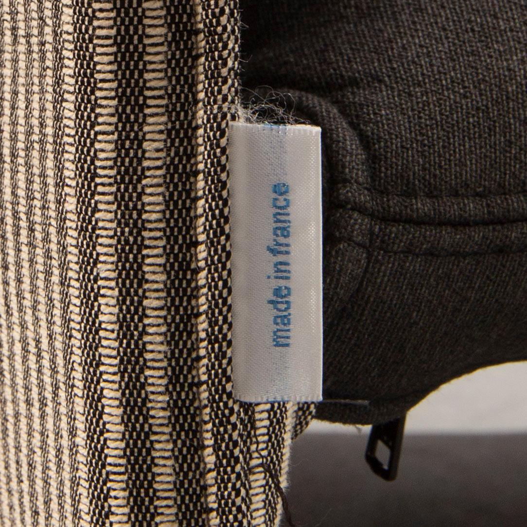 A Claude Brisson armchair and stool for Ligne Roset laer part of the 20th century.