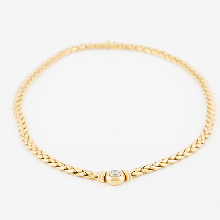 A necklace/bracelet combination in 18K gold set with a round brilliant-cut diamond ca 0.35 ct.