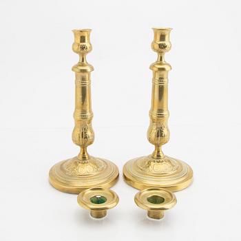 A pair of 19th century brass candle sticks.