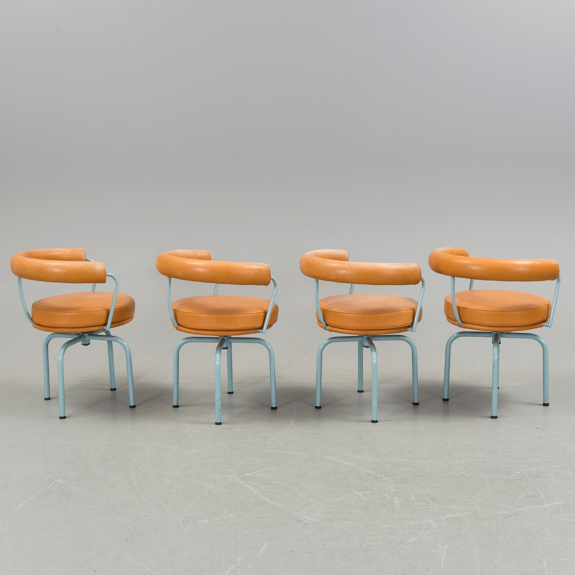 A set of four "LC7" chairs by Le Corbusier, Pierre Jeanneret and Charlotte Perriand for Cassina.