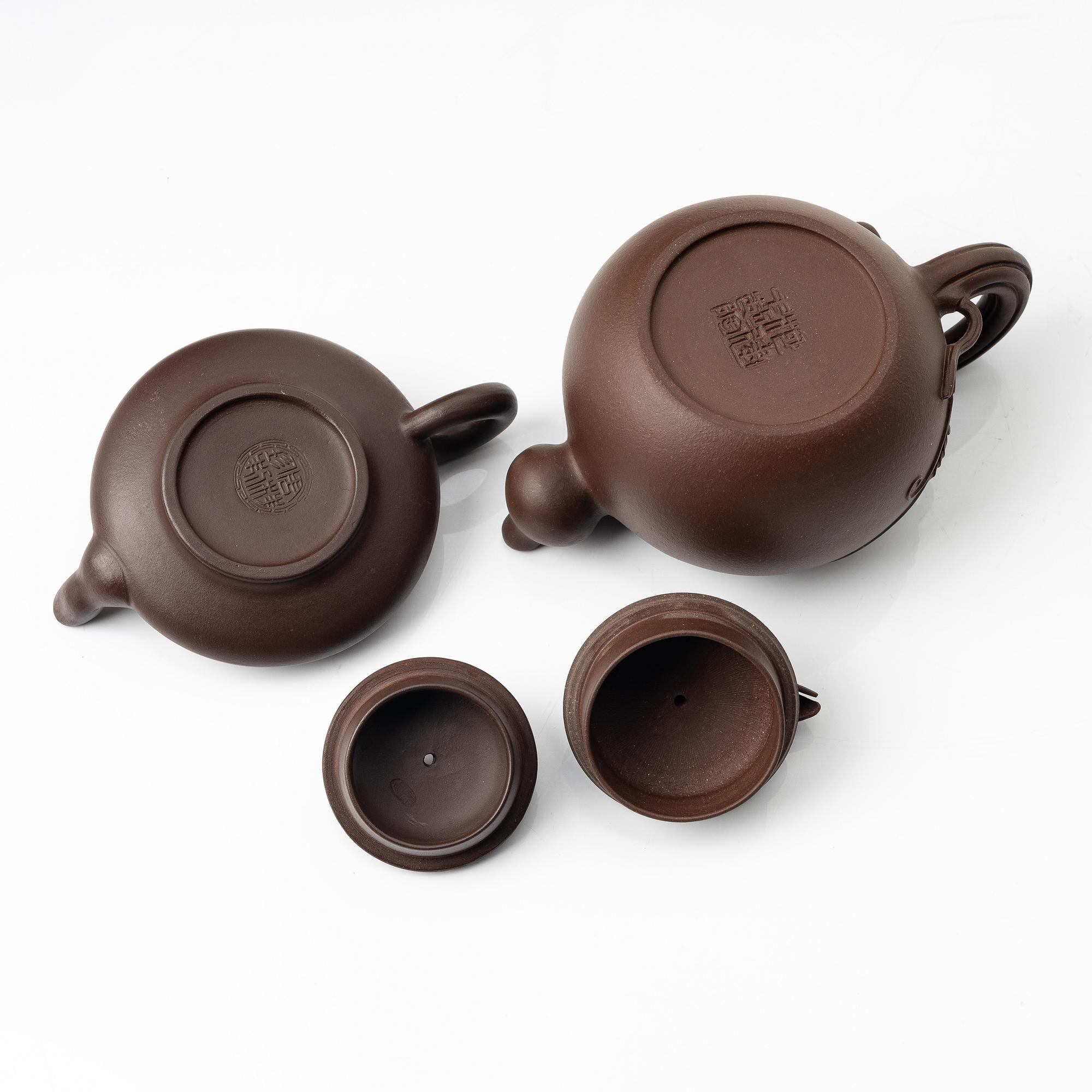 Two yixing teapots, China, 1980s and 2000.