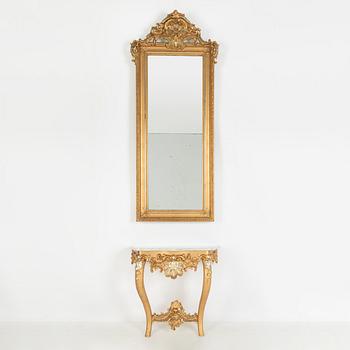 A rococo-style mirror and console table, around 1900.