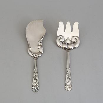 A two-piece Danish Art Nouveau silver serving set, design Thorvald Bindesbøll, maker's mark Rasmus Jensen, Horsens 1913.