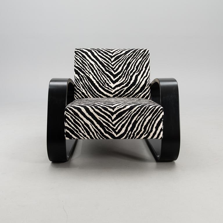 An armchair no 400, designed in 1936.