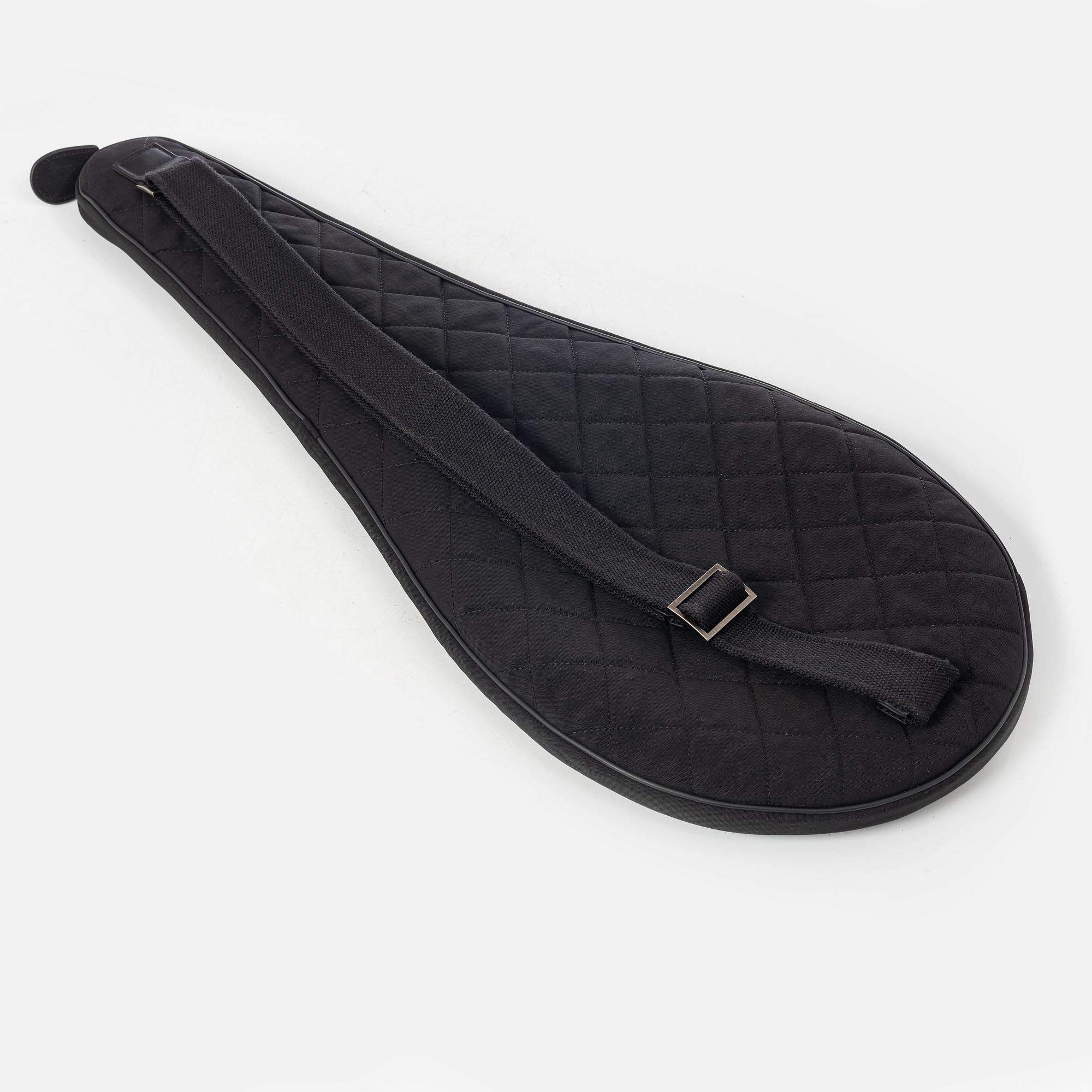 Chanel, tennis racket and 4 balls with case.