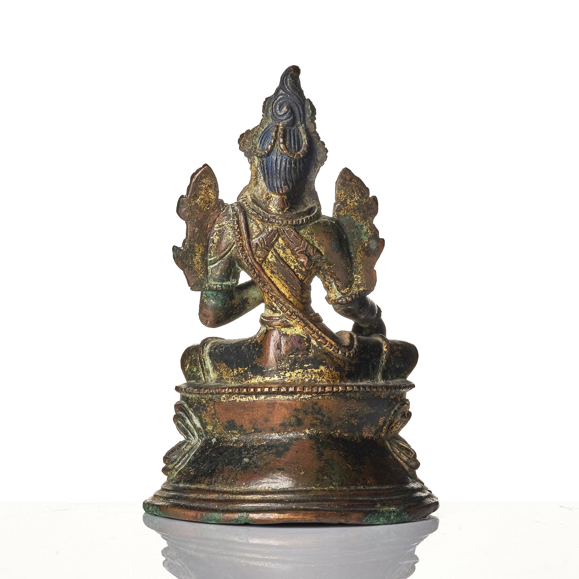 A copper alloy figure of Green Tara, Tibet, 17/18th century or later.