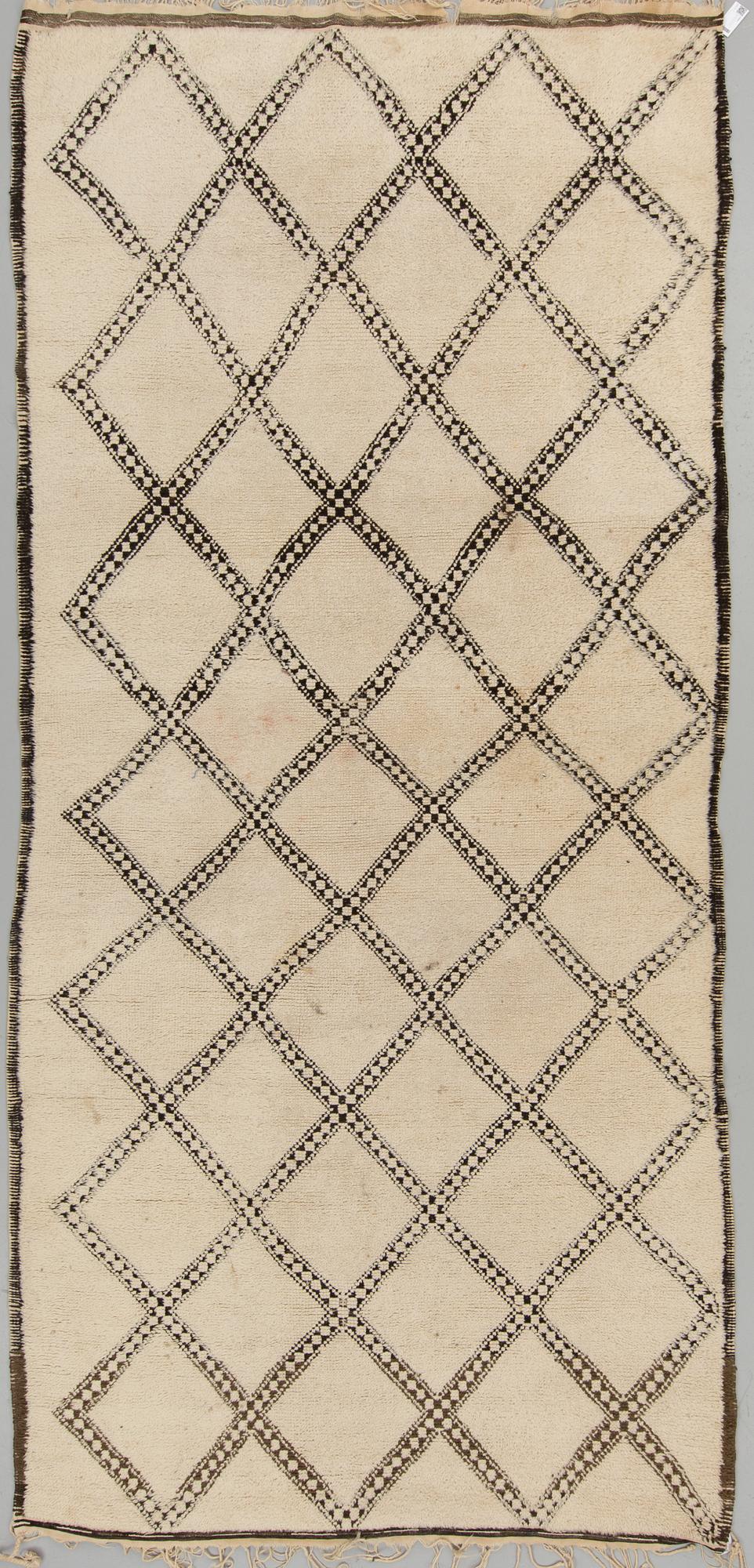 A CARPET, probably Morocco, old, ca 403 x 196 cm (plus a few cm flat weave at each end).