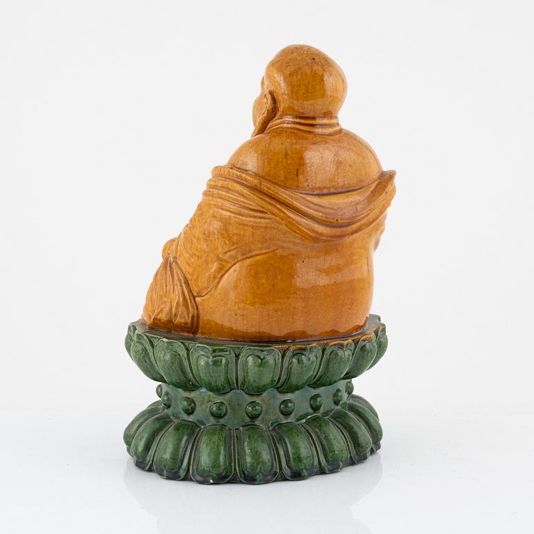 A ceramic Budai, China, 20th century.