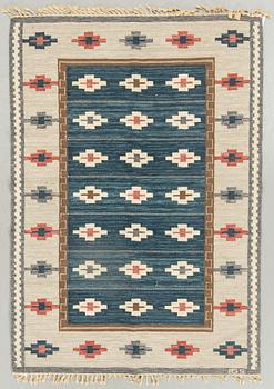 A Swedish signed flatweave carpet ca 242 x 170 cm.