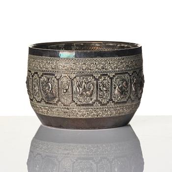 A Chinese brushpot, Qing dynasty, circa 1900. An archaistic bronze ewer and a silvered South East Asian bowl with stand.